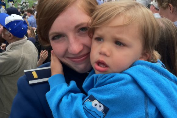 military mother holds child