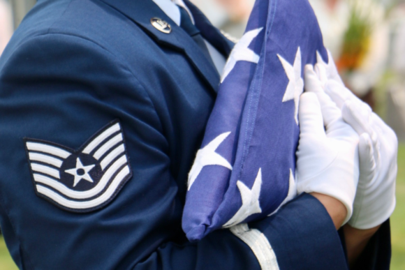 folded flag at military funeral